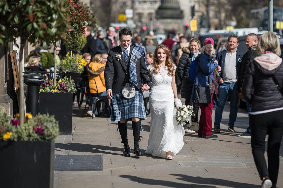 newlyweds walking along George STreet