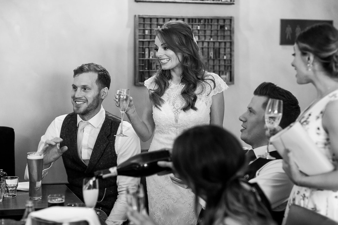 bride chatting with guests in the Library