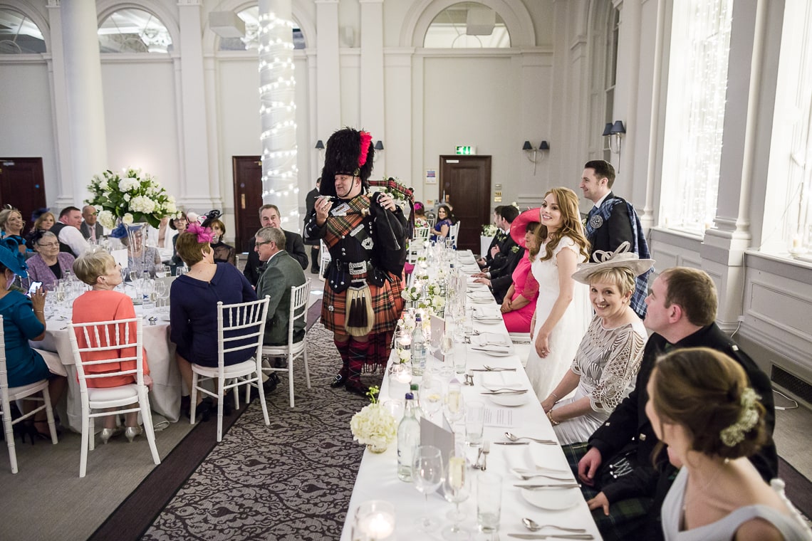 piper toast to the newlyweds in the King's Hall