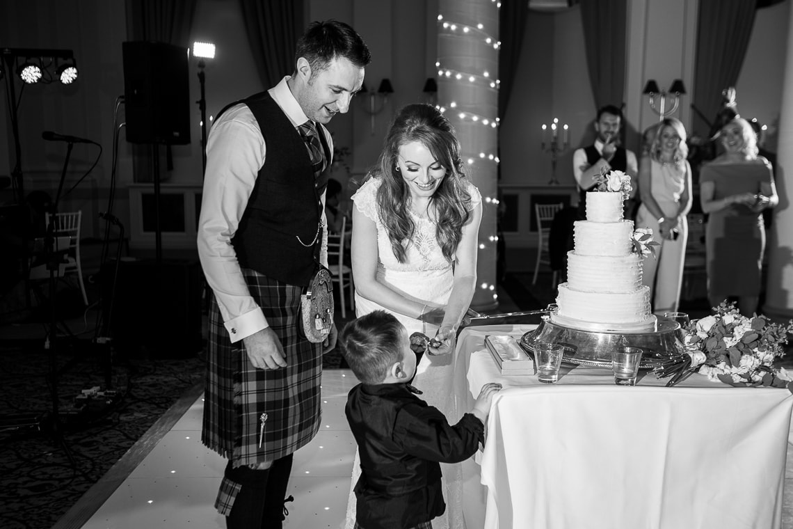 little boy wants a piece of cake in the King's Hall