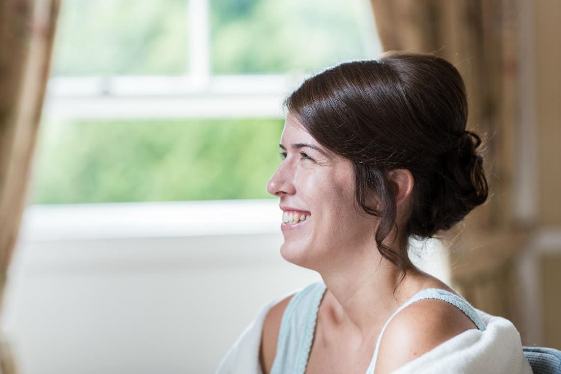 bride smiling during preparations