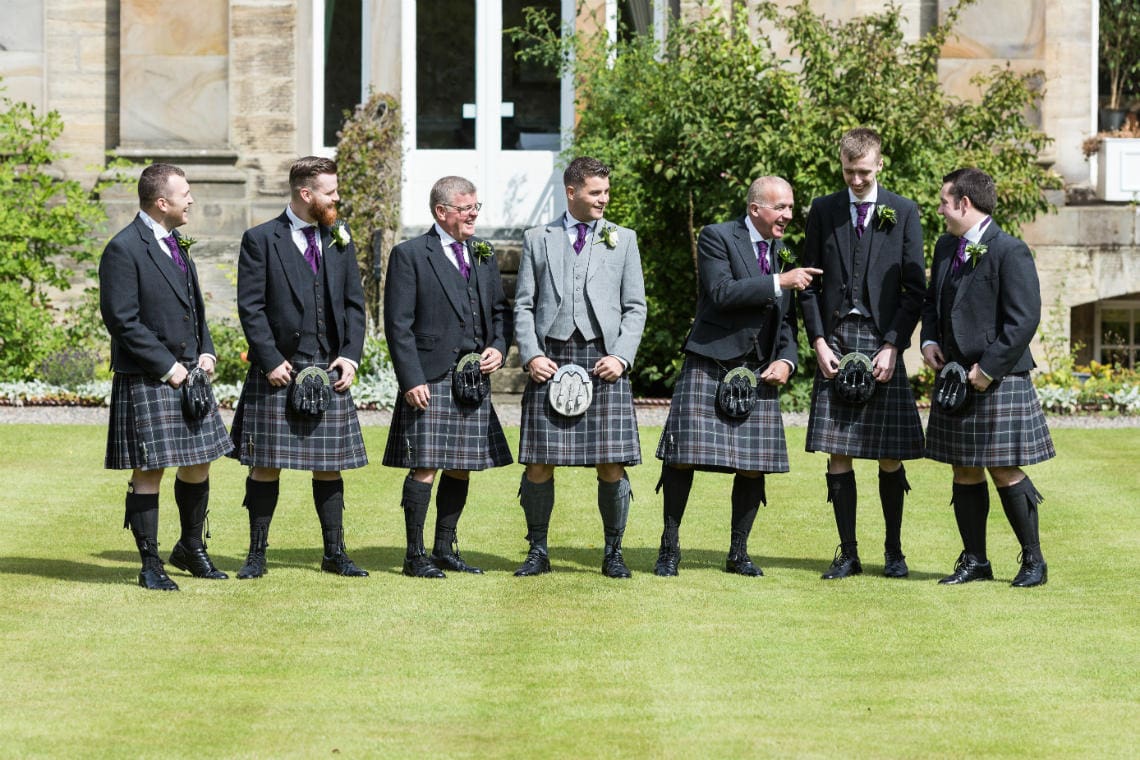 Groom and the boys on the lawn