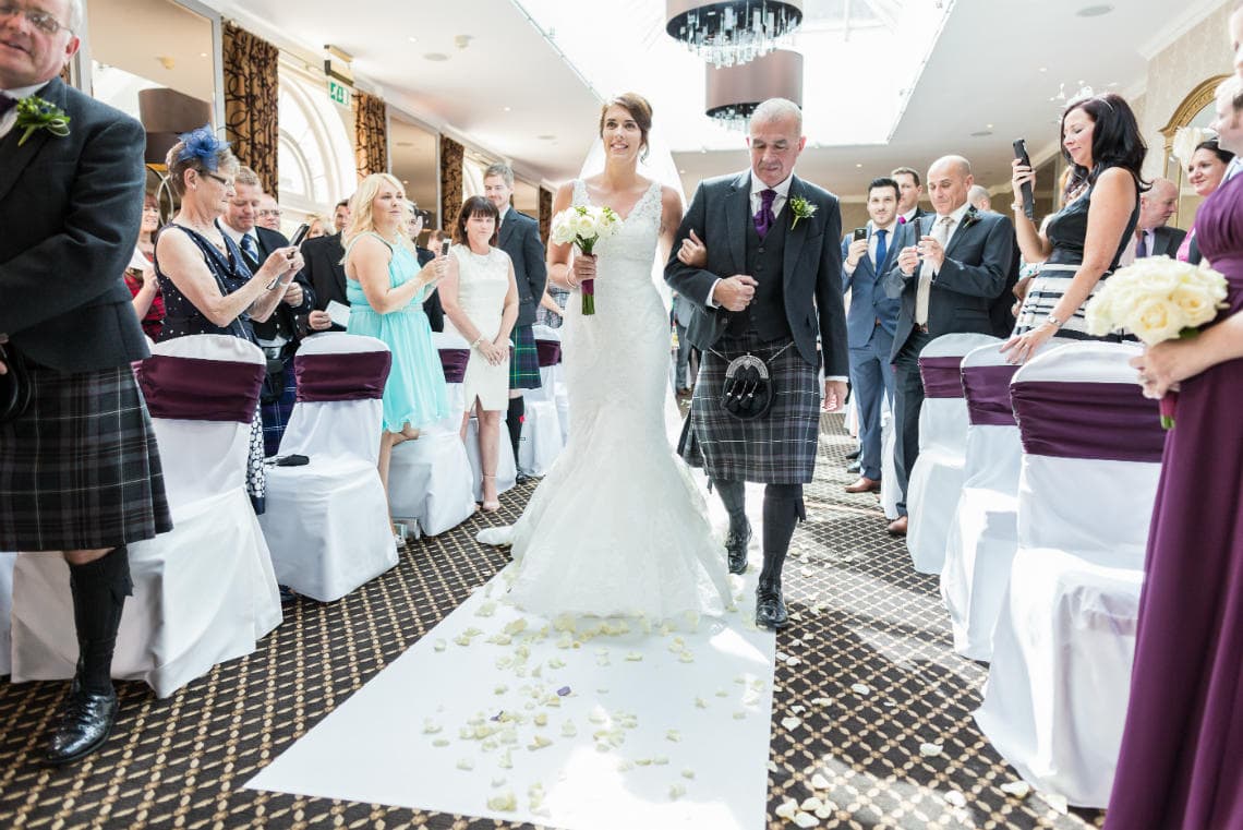 wedding processional bride walks up the aisle