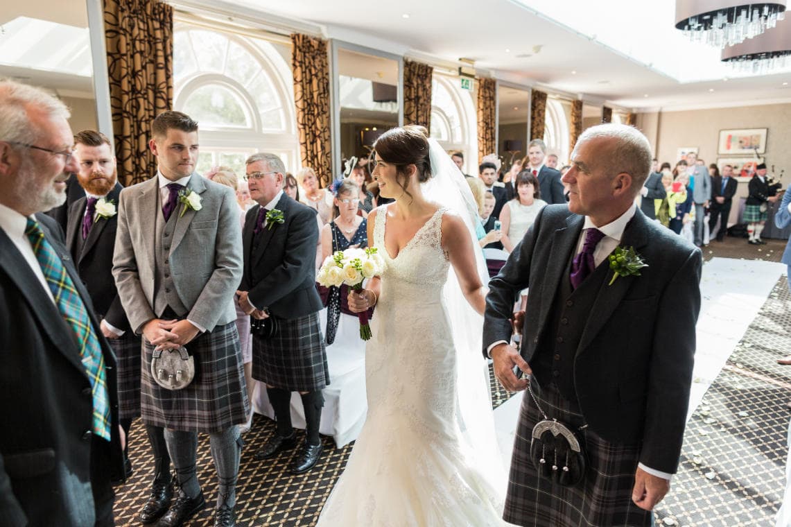 bride smiles as she meets her groom during Humanist ceremony in The Ballroom