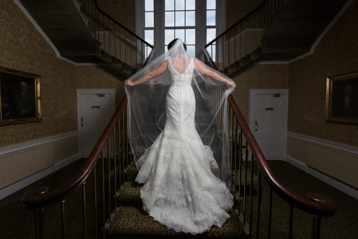 bridal pose on the staircase