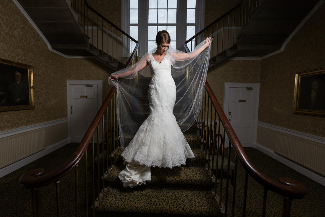 bridal pose on the staircase