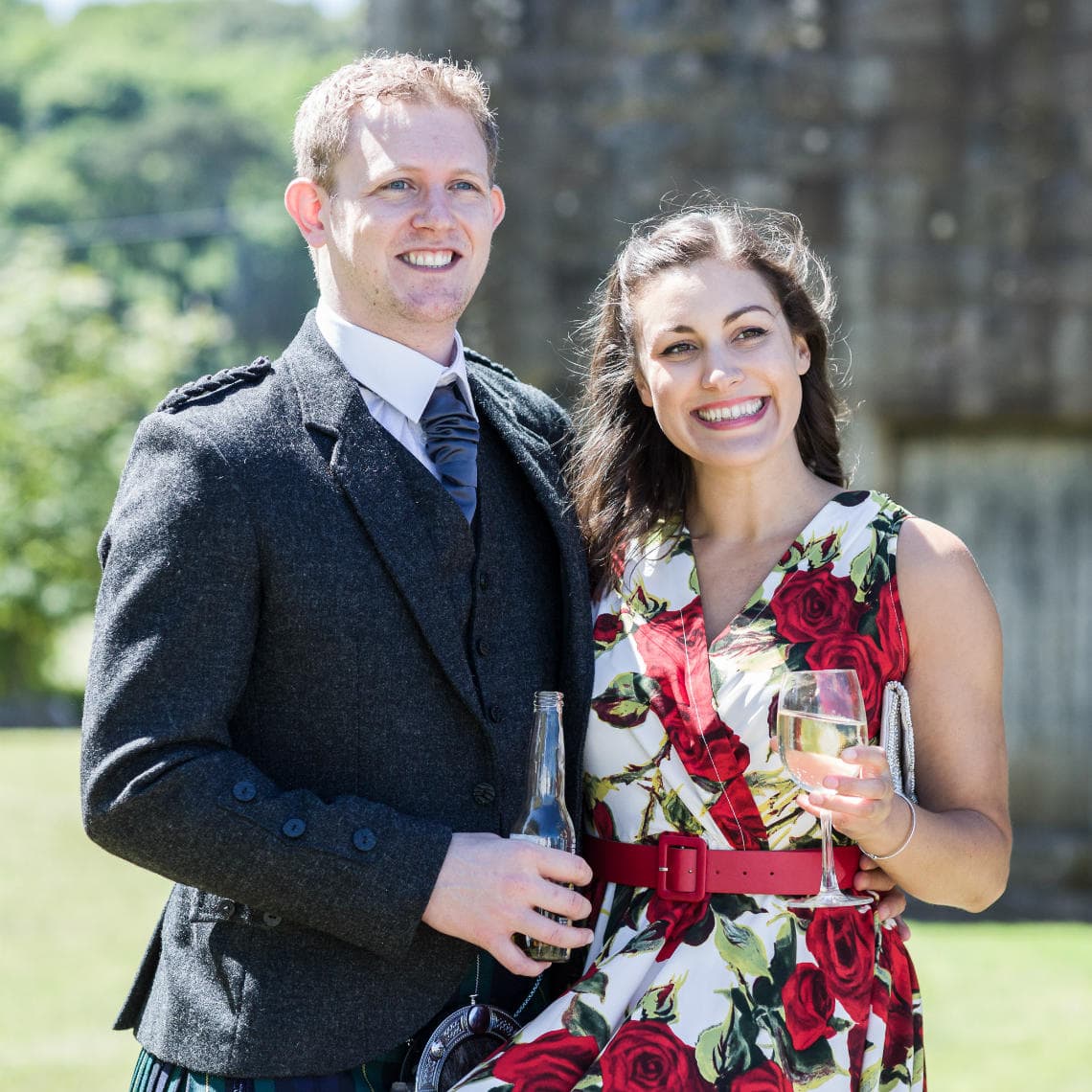 wedding guests outside having pre-ceremony drinks
