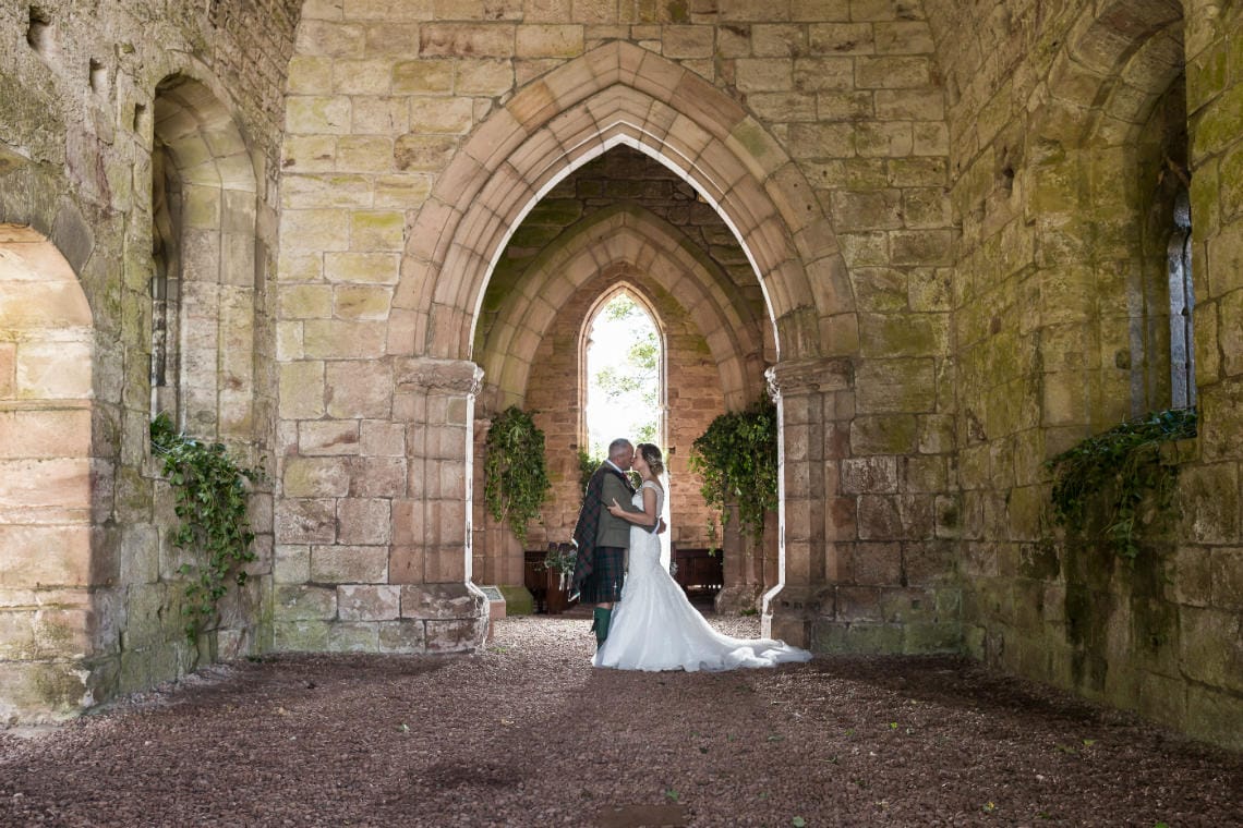 newlyweds sharing a kiss in the church