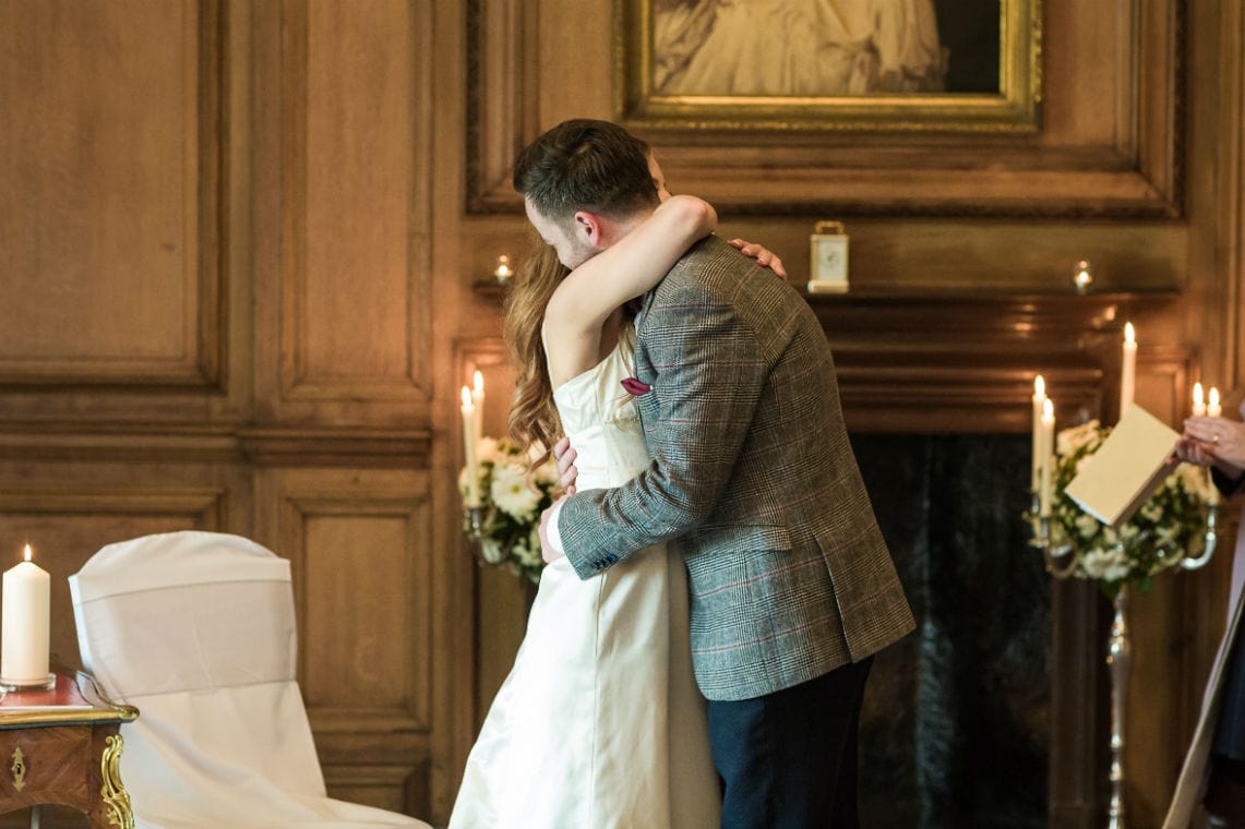 Newlyweds cuddling each other