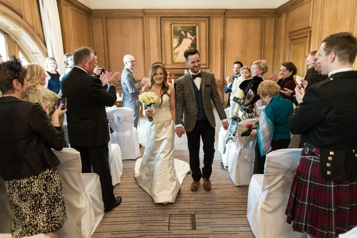 Newlyweds walking down the aisle