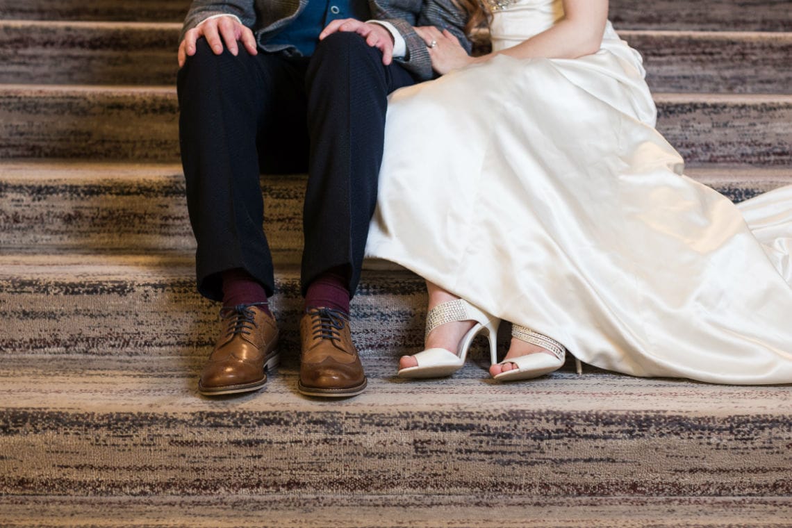 Photo of newlyweds shoes taken on the staircase