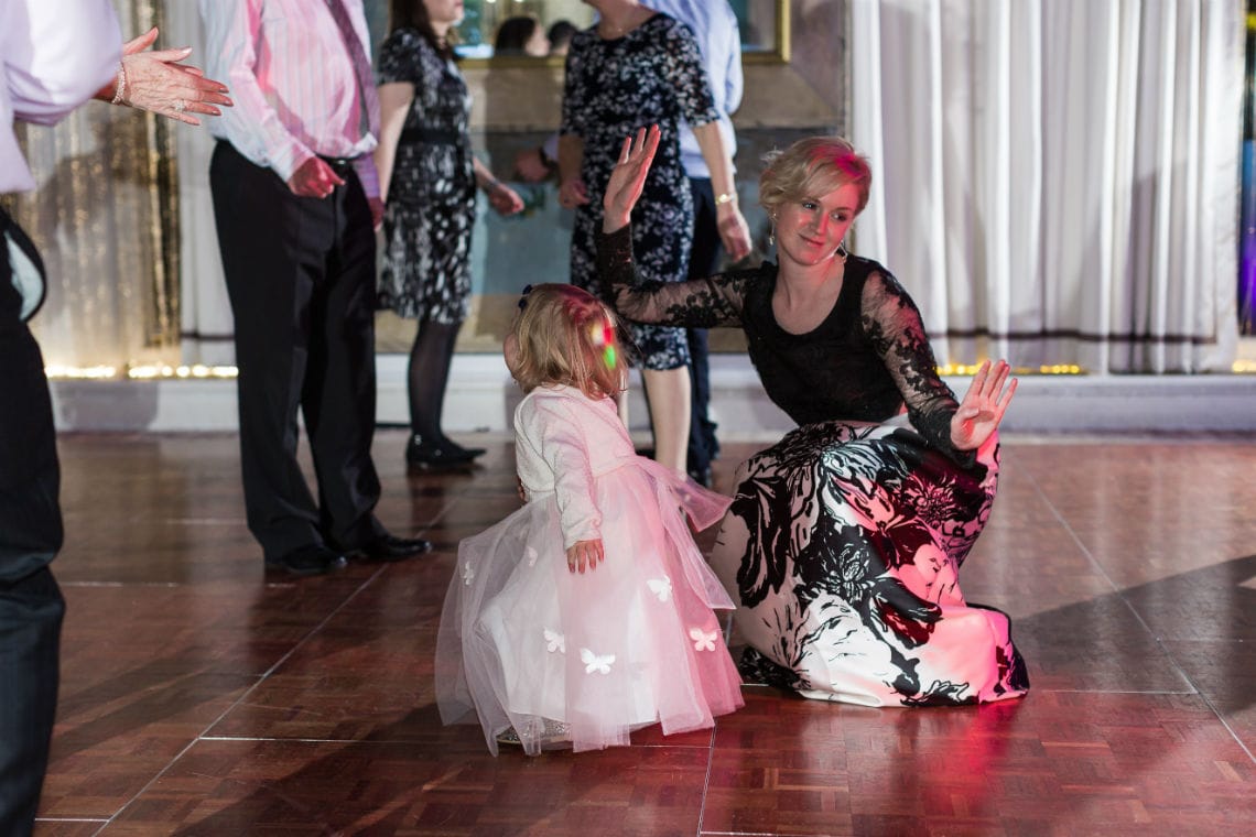 Lady and little flower girl on the dancefloor