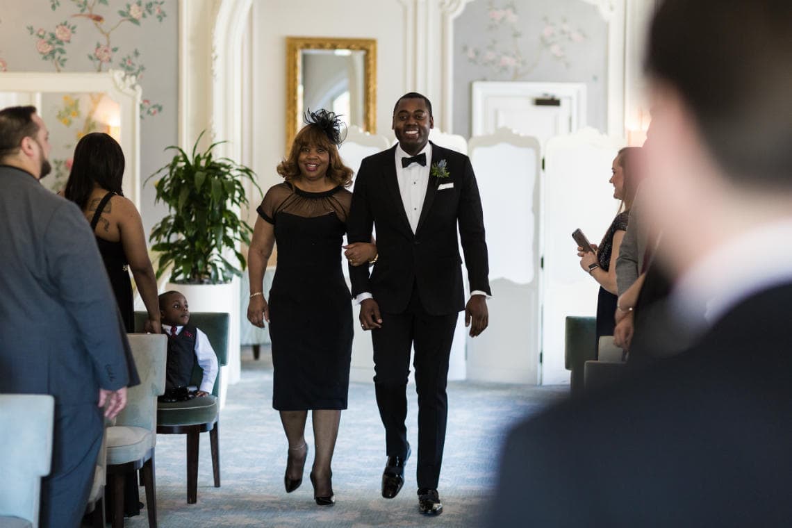 groom walking up the aisle at The Pompadour
