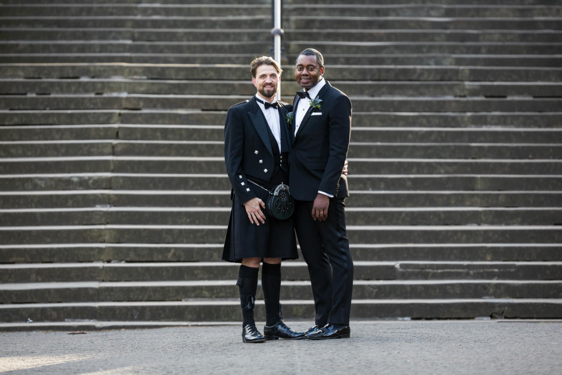 wedding at Waldorf Astoria Edinburgh same-sex newly-weds in Princes Street Gardens