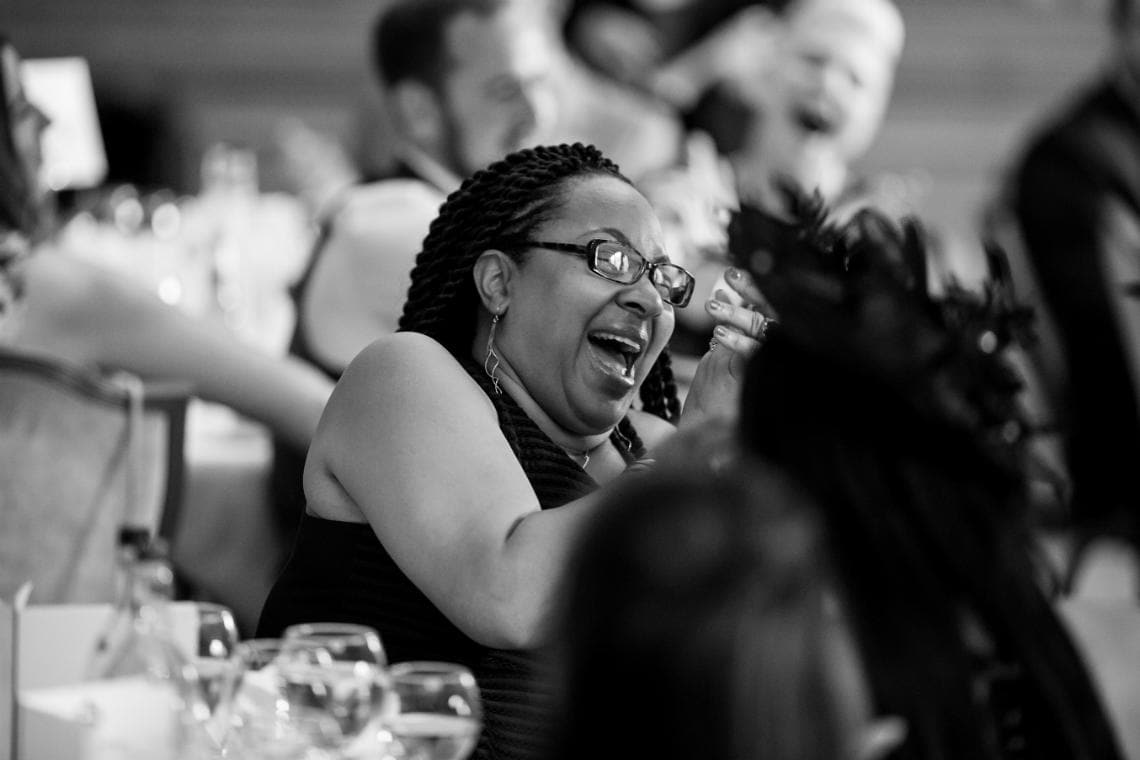 guest laughing during speeches in The Boardroom